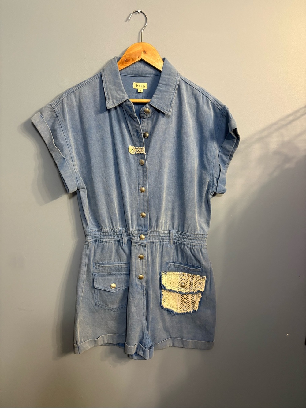 POL Women’s Blue Denim One-Piece Romper with Crochet Pocket